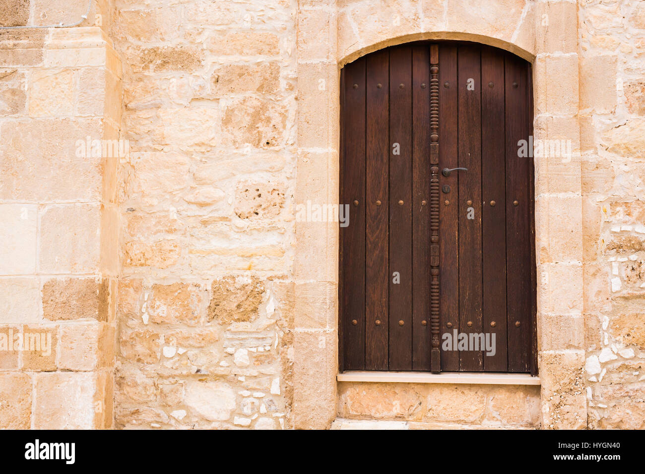 Ancient wooden door in stone castle wall Stock Photo - Alamy