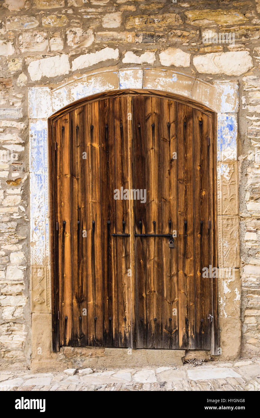 Ancient wooden door in stone castle wall Stock Photo - Alamy