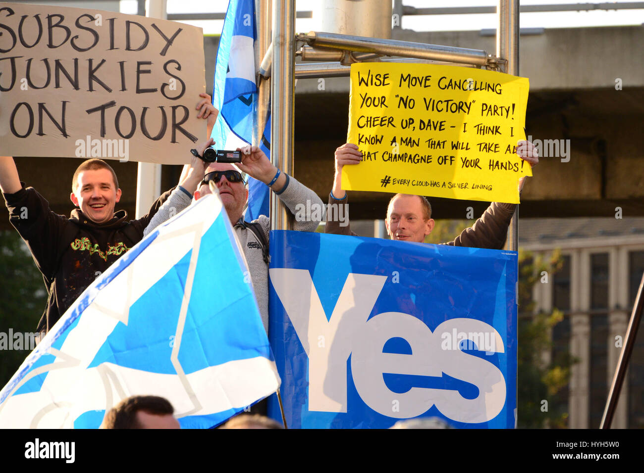 Anti-Conservative protesters and 'Yes' supporters demonstrate outside the Hillton Hotel in Glasgow, where Prime minister David Cameron was addressing a CBI Scotland dinner three weeks before the Scottish independence referendum Stock Photo