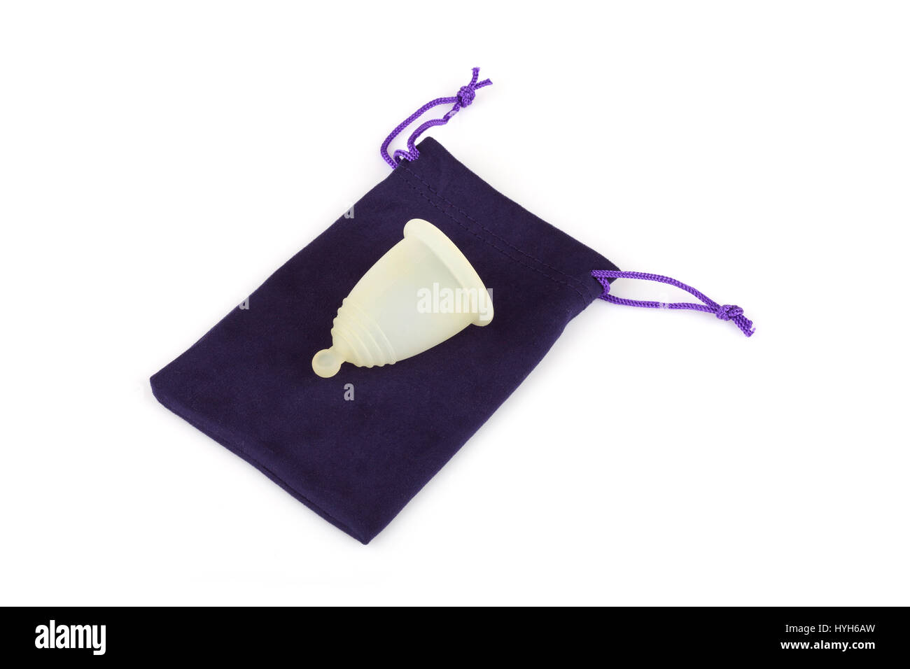 Silicone menstrual cup on a microfiber storage pouch. Menstrual cup is eco-friendly, practical, safe and inexpensive Stock Photo