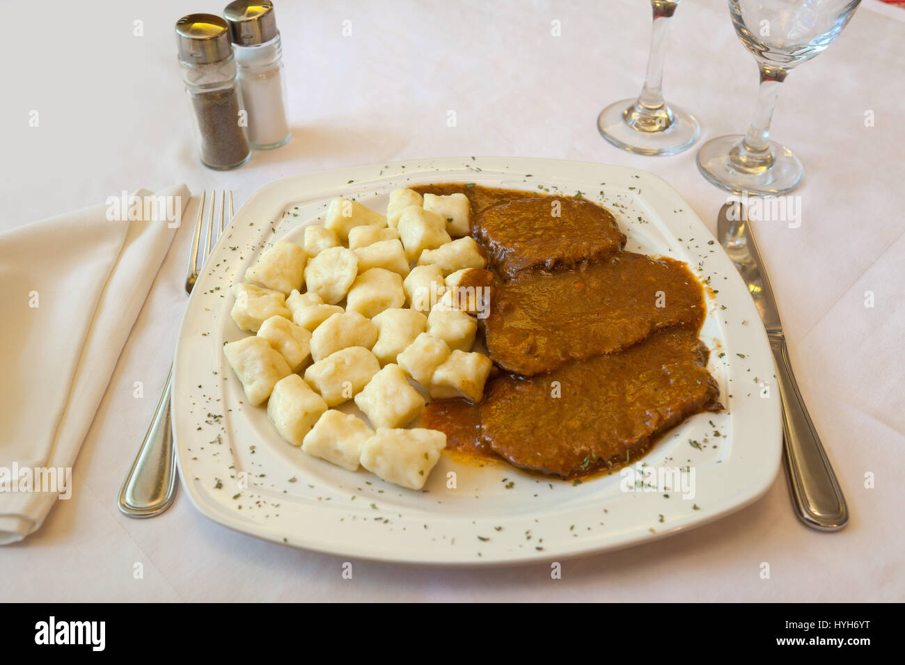 Croatian traditional cuisine, Pasticada With Gnocchi - Dalmatian Pot Roast or beef stew Stock Photo