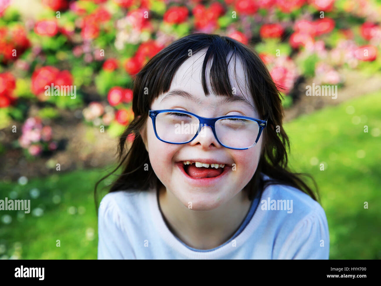 Portrait of little girl smiling outside Stock Photo - Alamy