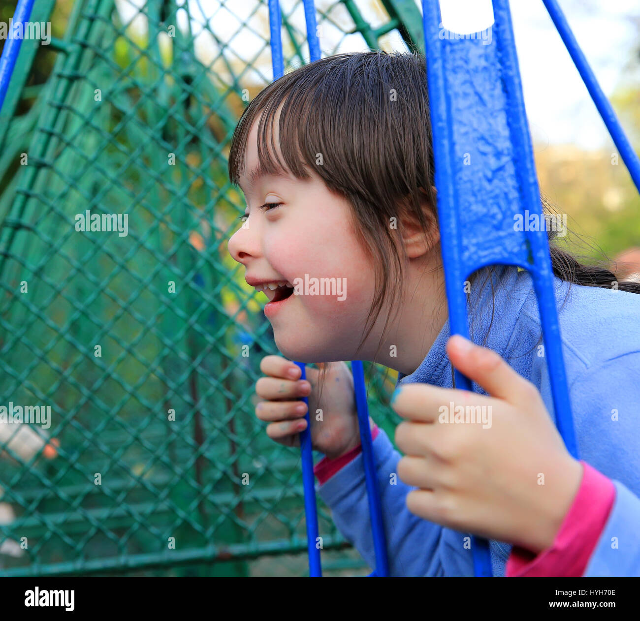 Portrait of little girl smiling outside Stock Photo - Alamy