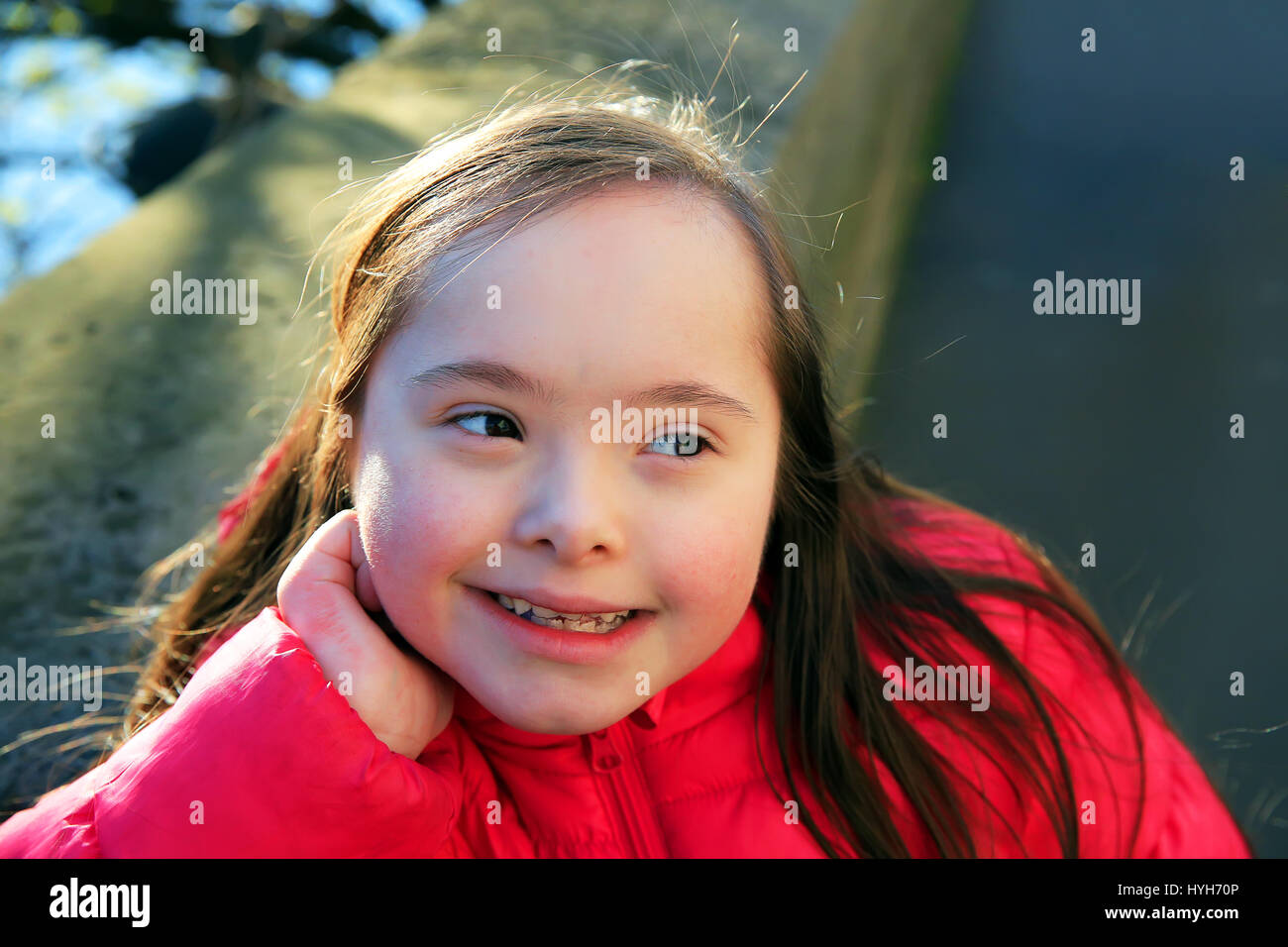 Portrait of little girl smiling outside Stock Photo - Alamy
