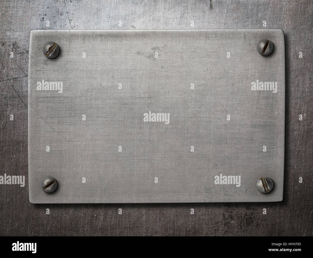 old steel plate with bolts on metal background Stock Photo