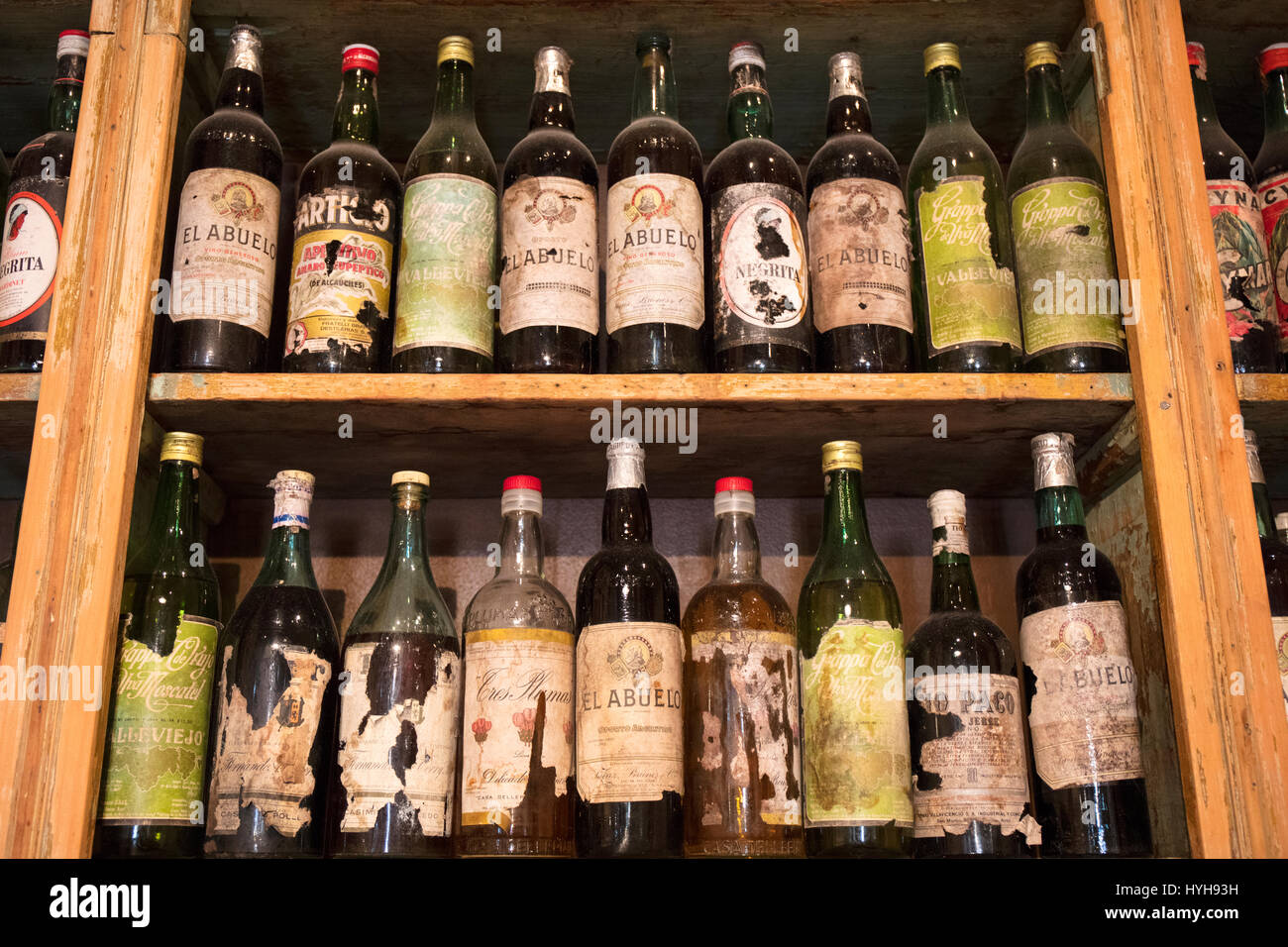Old vintage bottles inside a bar in San Telmo. Buenos Aires, Argentina. Stock Photo
