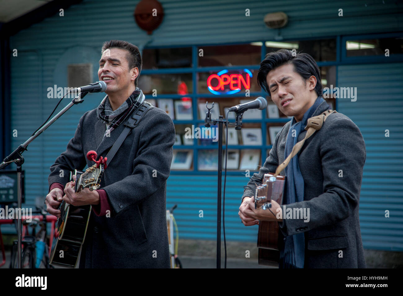Young guitarists and singer performing outdoors, Granville Island, Vancouver, British Columbia, Canada Stock Photo
