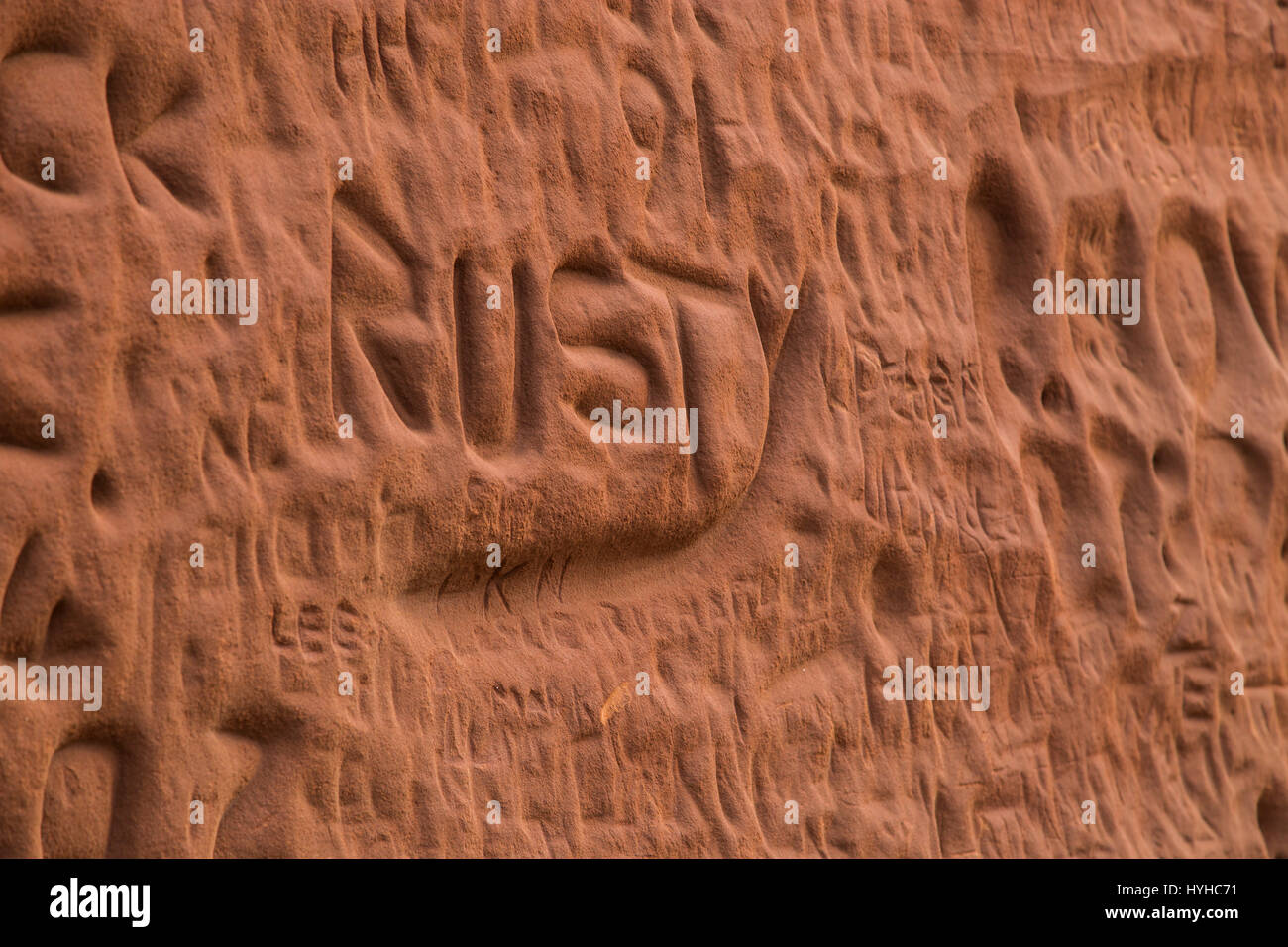Names carved into the soft red sandstone cliffs at Sidmouth,Devon. Stock Photo