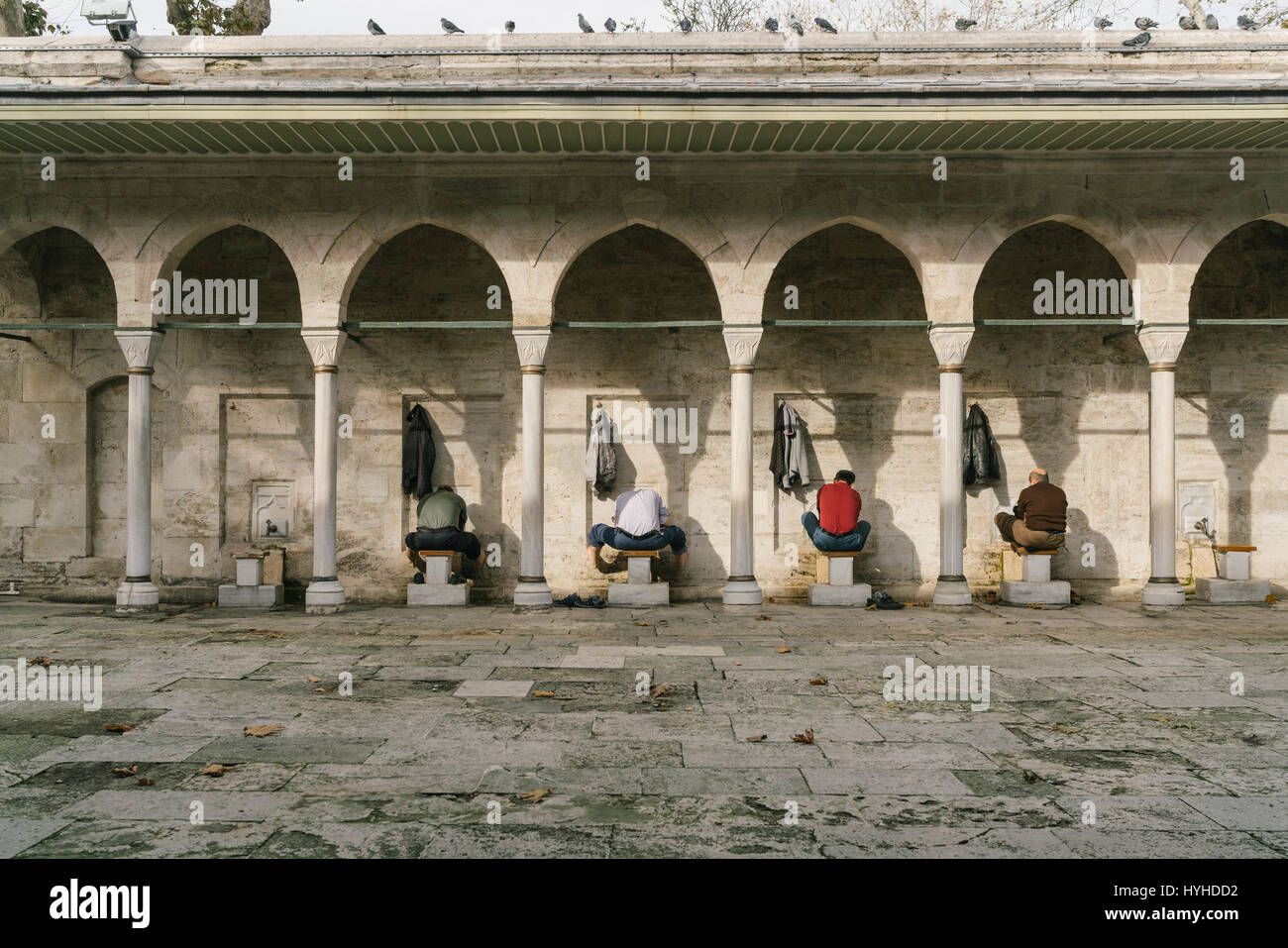 Men wash before prayer at the Mosque in Istanbul, Turkey Stock Photo