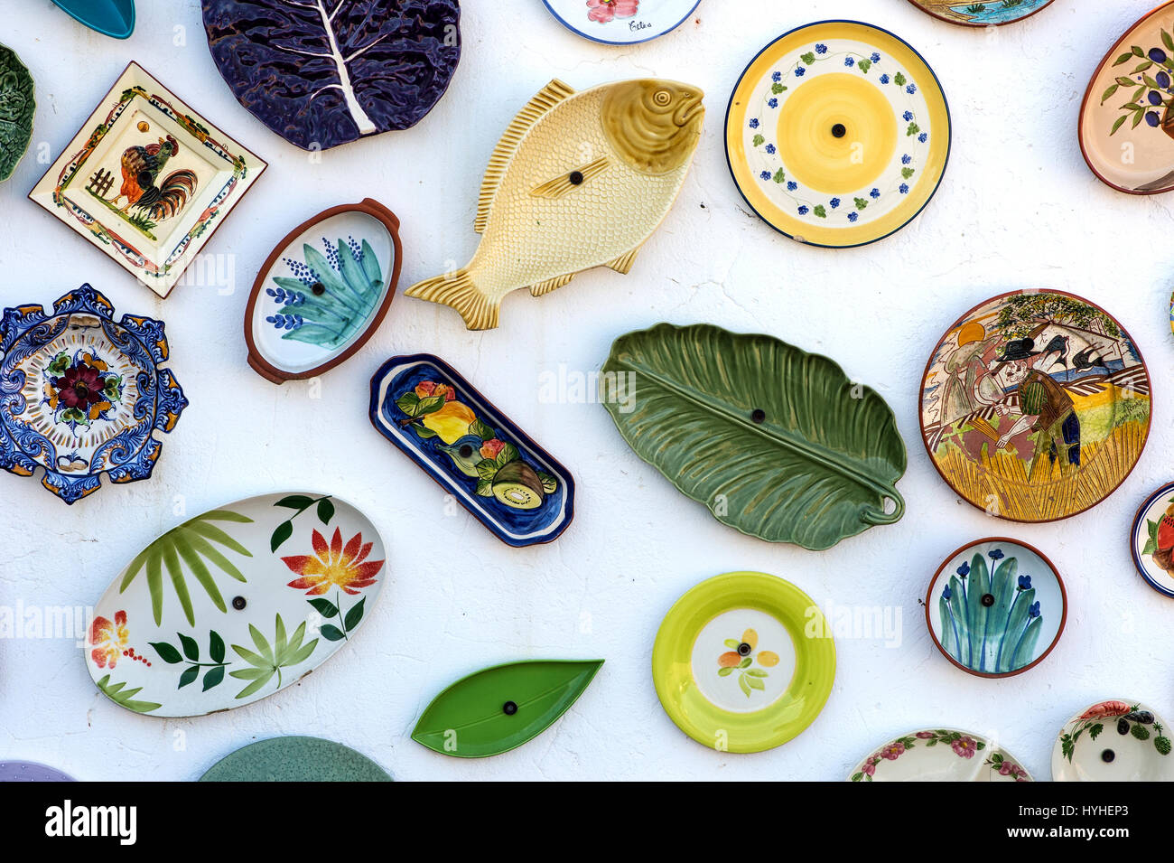 Handpainted traditional Portuguese pottery at the wall of the pottery