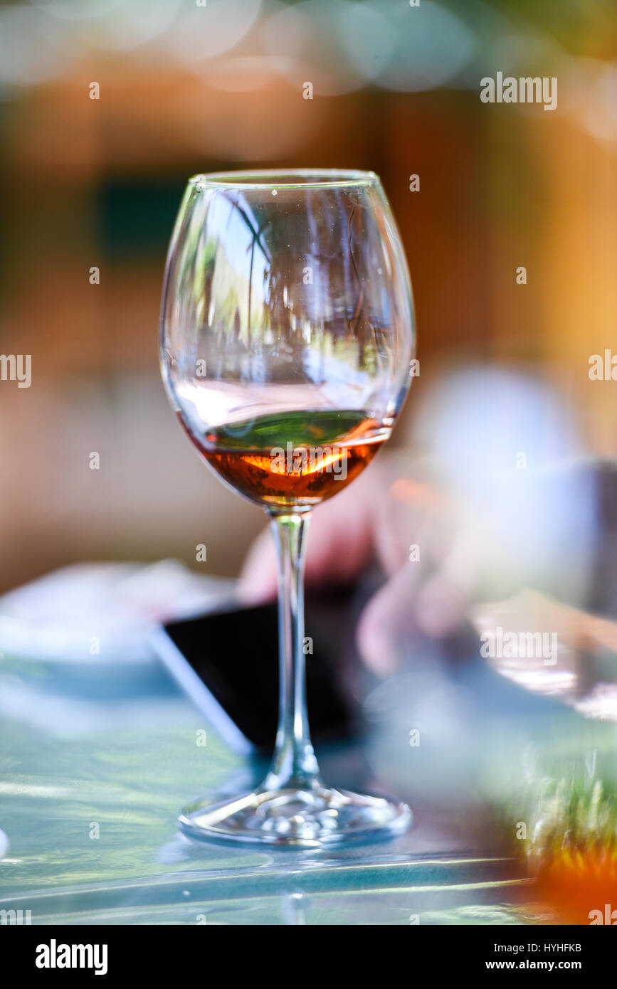 Hand pouring wine to a wine glass Stock Photo Alamy