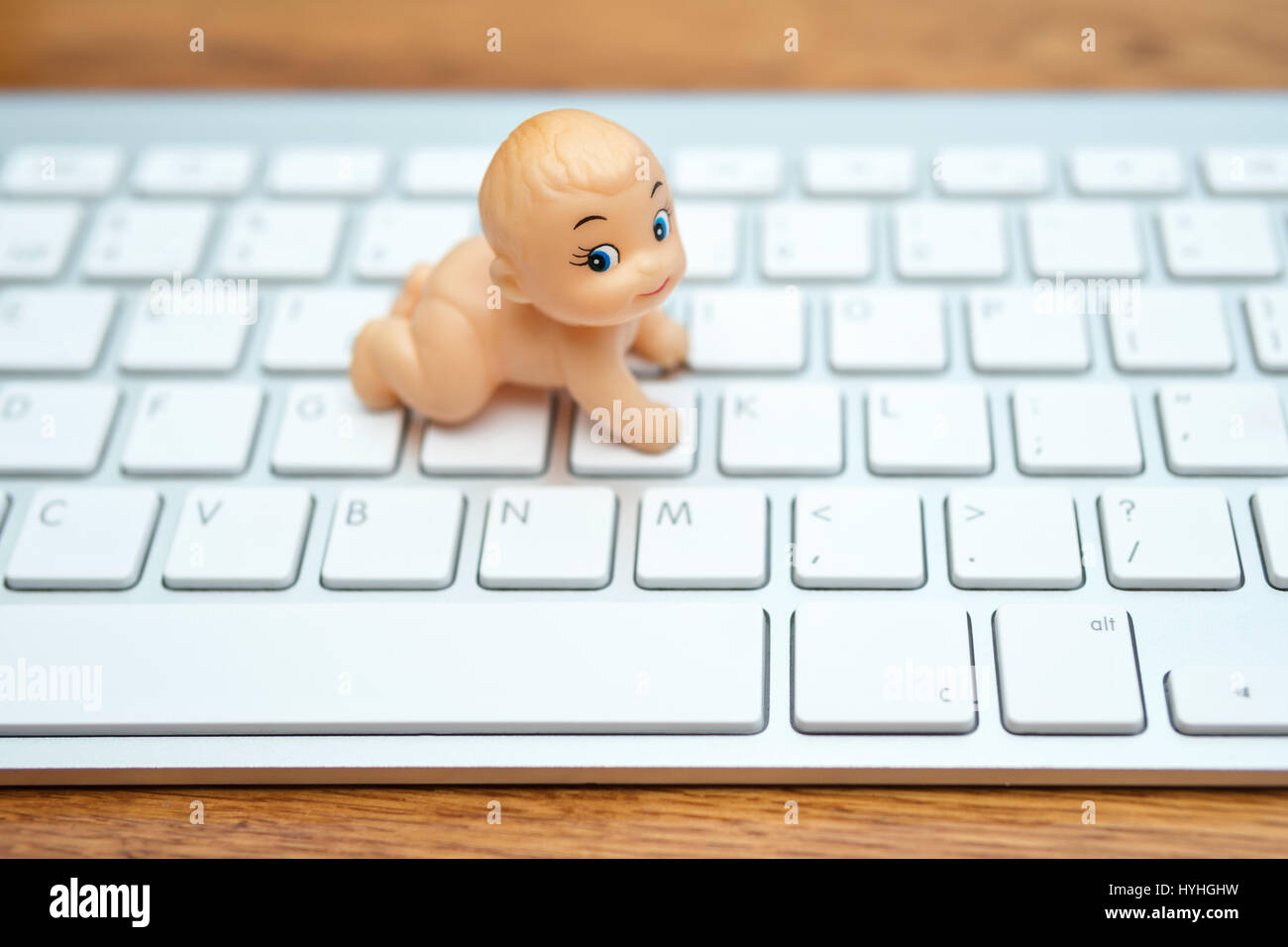 Little puppet kid on the keyboard Stock Photo Alamy