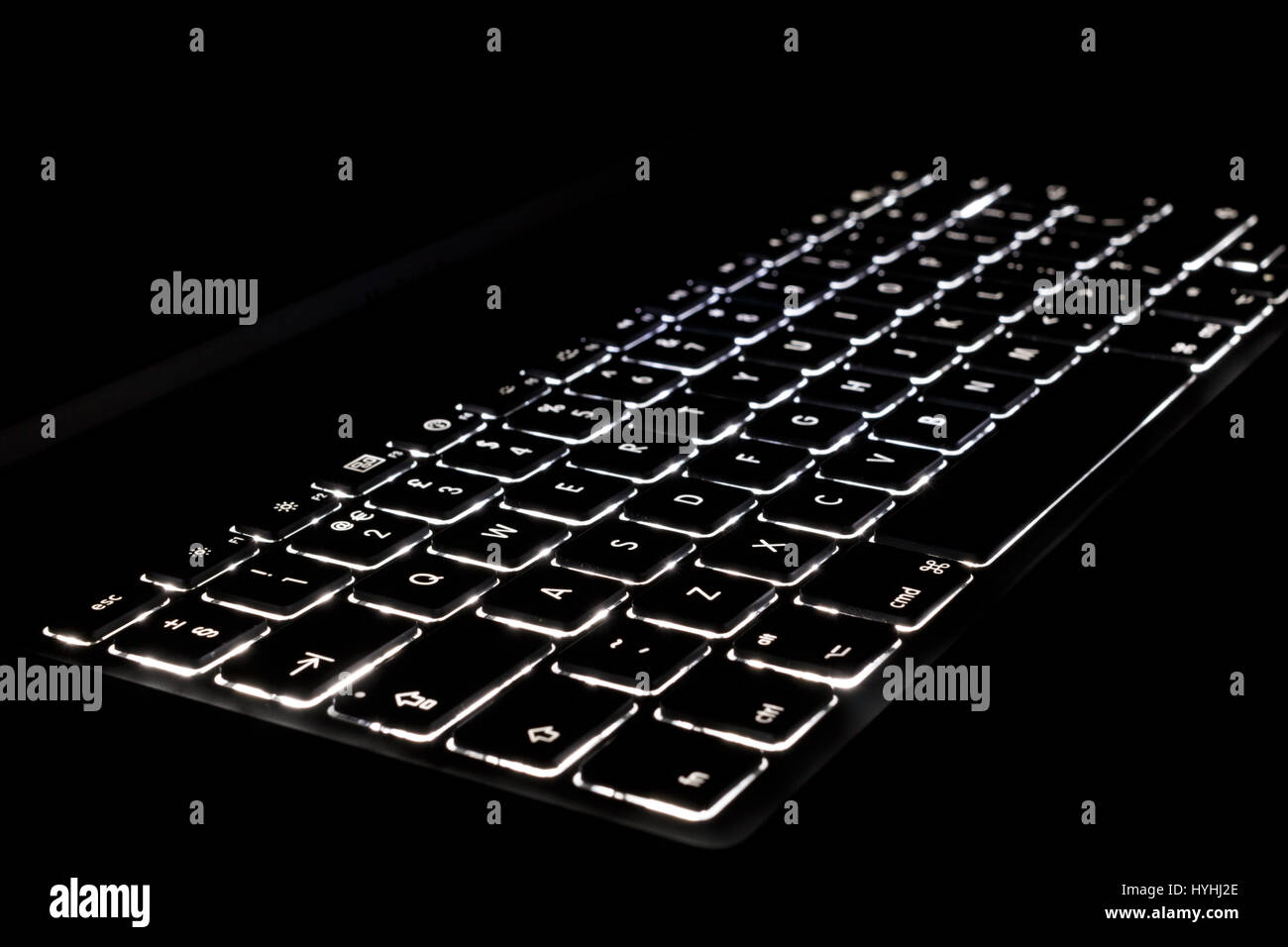 An illuminated keyboard on a black background Stock Photo