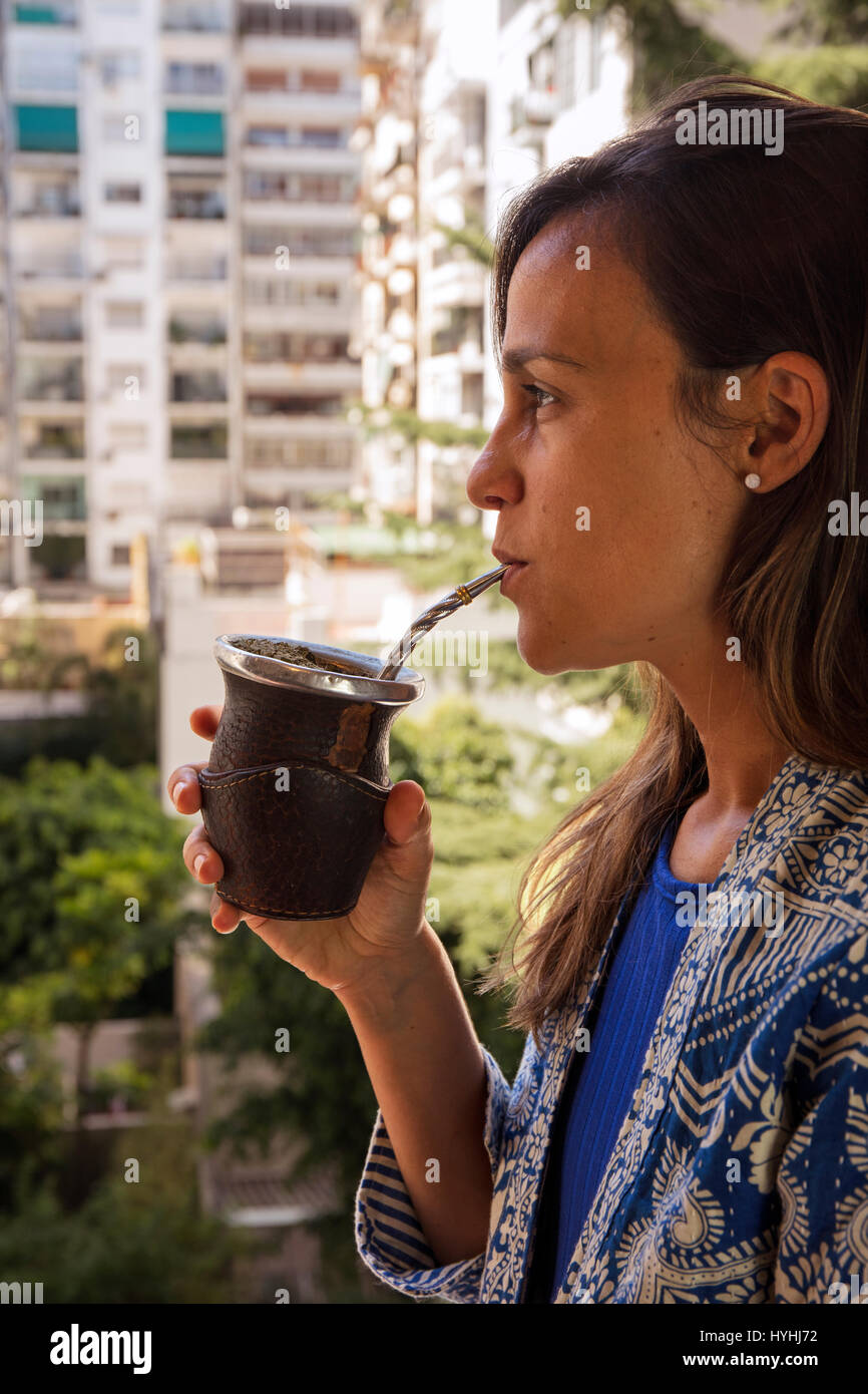 Girl drinking mate. Buenos Aires, Argentina. Stock Photo