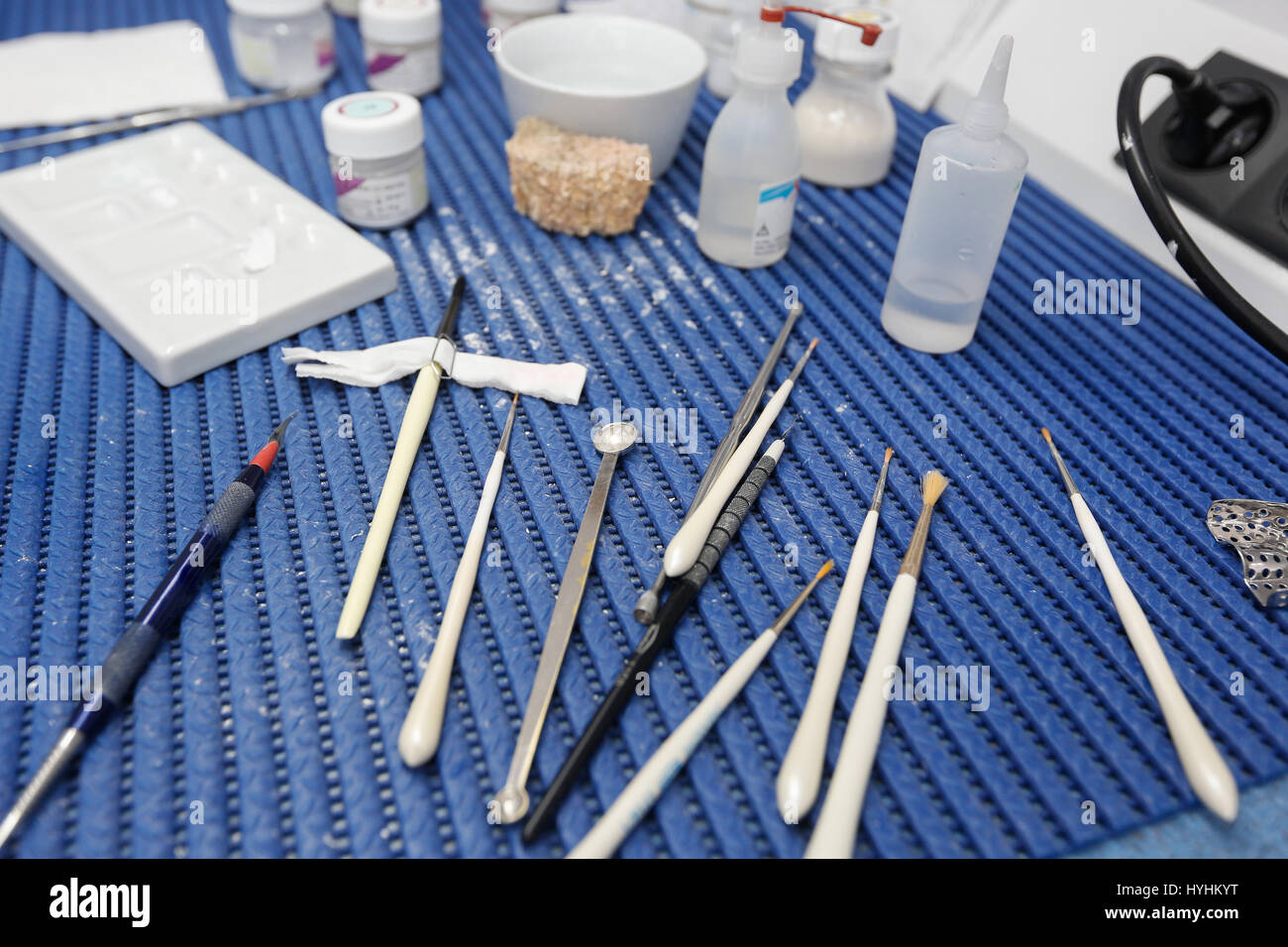Dental lab tools and instruments for porcelain layering in the process of denture, veneer and implant manufacturing. Dentistry, prostodontics, prosthe Stock Photo