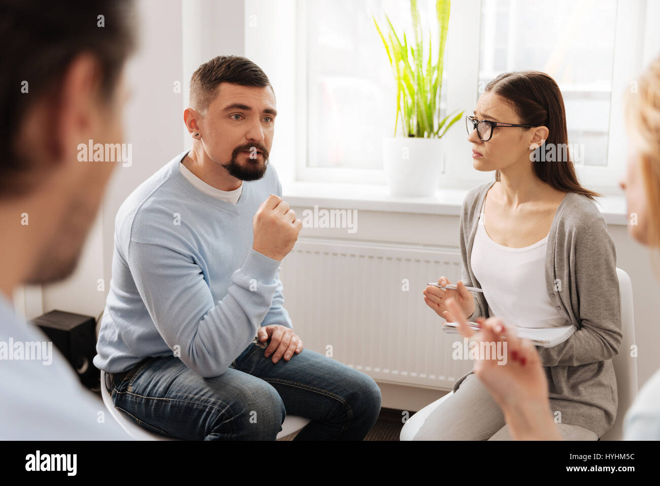 Resolute male person sharing his experience Stock Photo