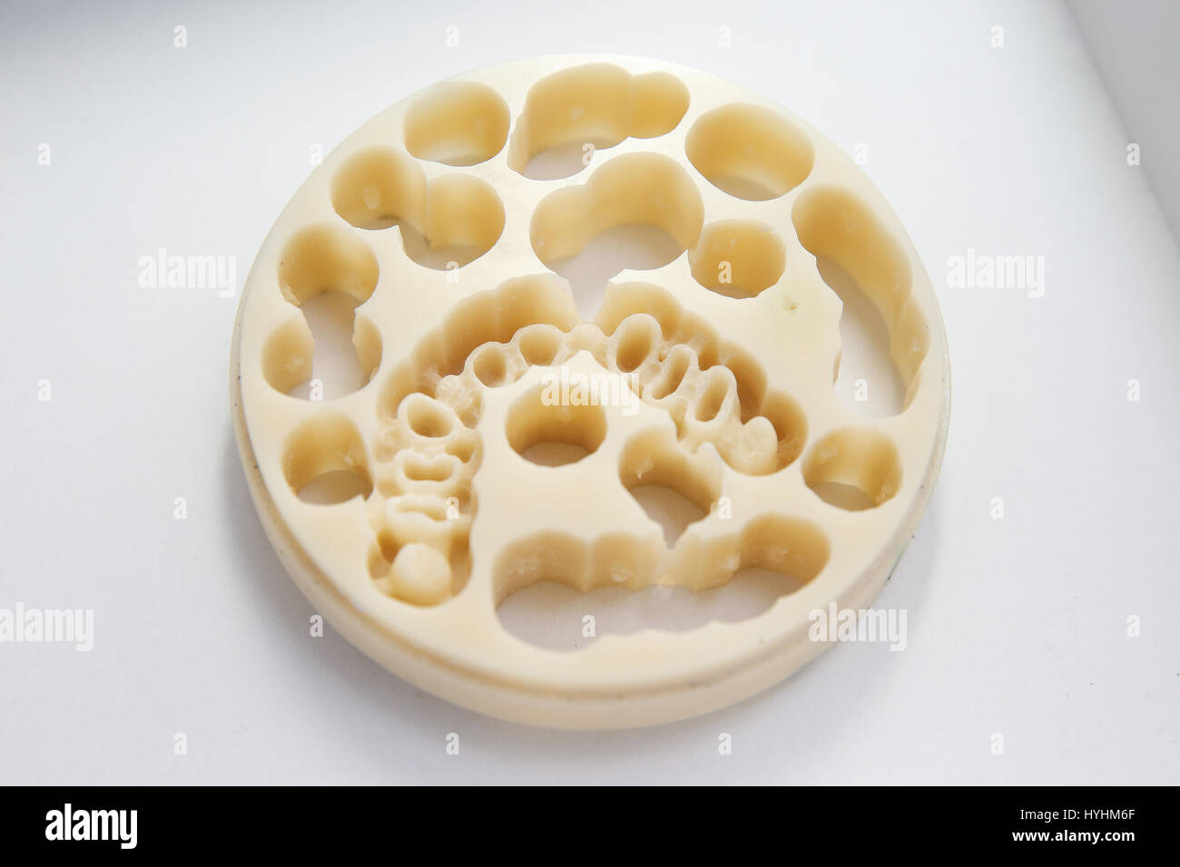 Porcelain disc for CAD/CAM dental machinery for milling prosthesis and crowns. Dentistry, prostodontics, prosthetic dentistry and computer aided machi Stock Photo