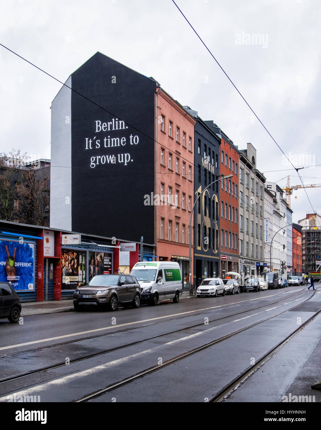 Berlin, Mitte. Mercedes Benz mural advertisement with advertising slogan 'Berlin it's time to grow up'. Luxury motor car ad in city street. Stock Photo