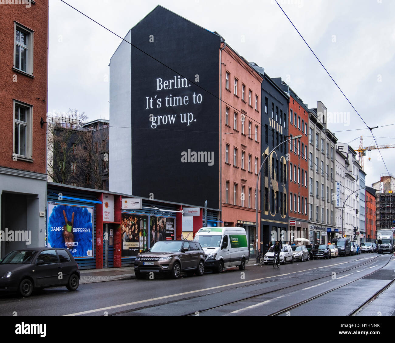 Berlin, Mitte. Mercedes Benz mural advertisement with advertising slogan 'Berlin it's time to grow up'. Luxury motor car ad in city street. Stock Photo