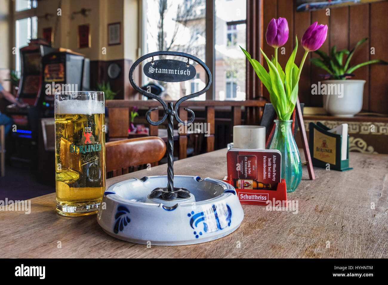 Berlin, Mitte, Zum Biermichel Traditional German Corner pub interior, typical Local bar with beer, flowers and Stammtisch sign Stock Photo