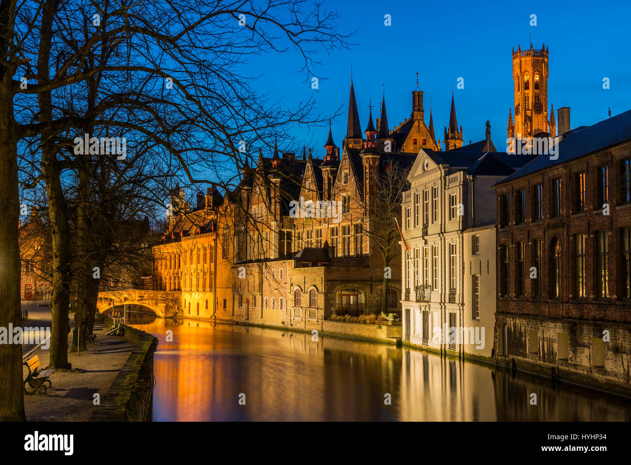 Night view over Dijver canal with Belfort tower in the background, Bruges, West Flanders, Belgium Stock Photo