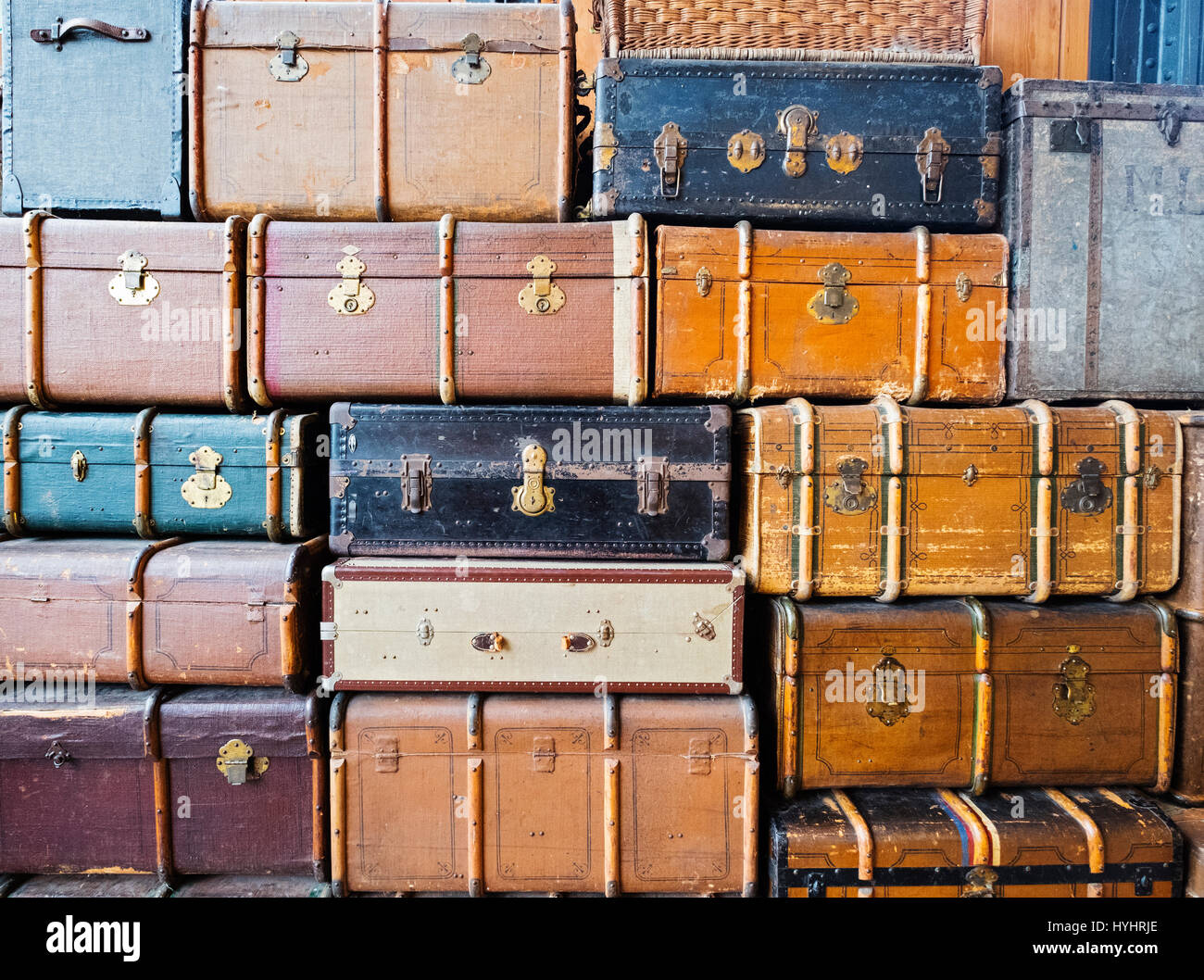 Many old suitcases stacked up Stock Photo