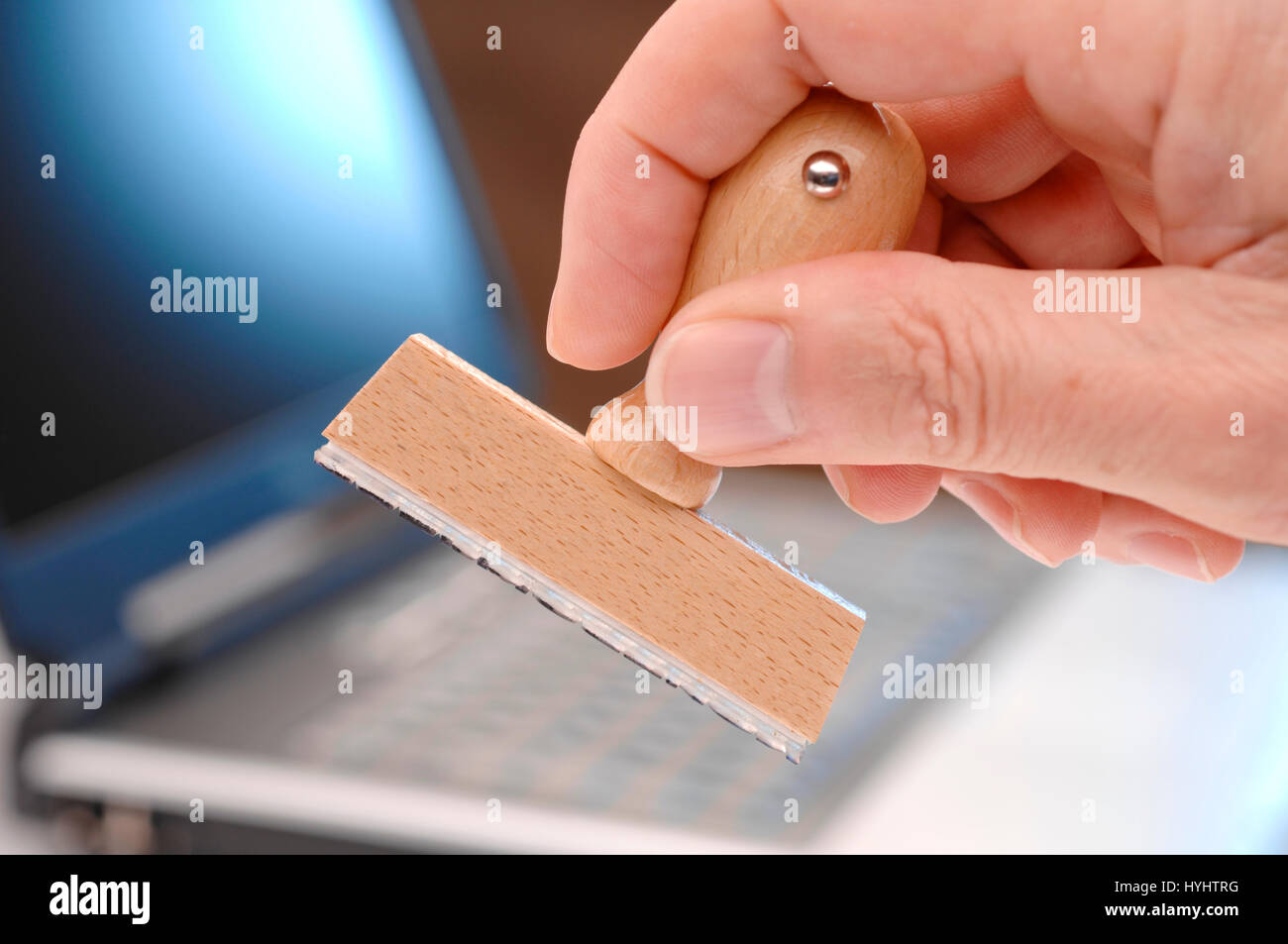 blank rubber stamp in hand ready for your text Stock Photo