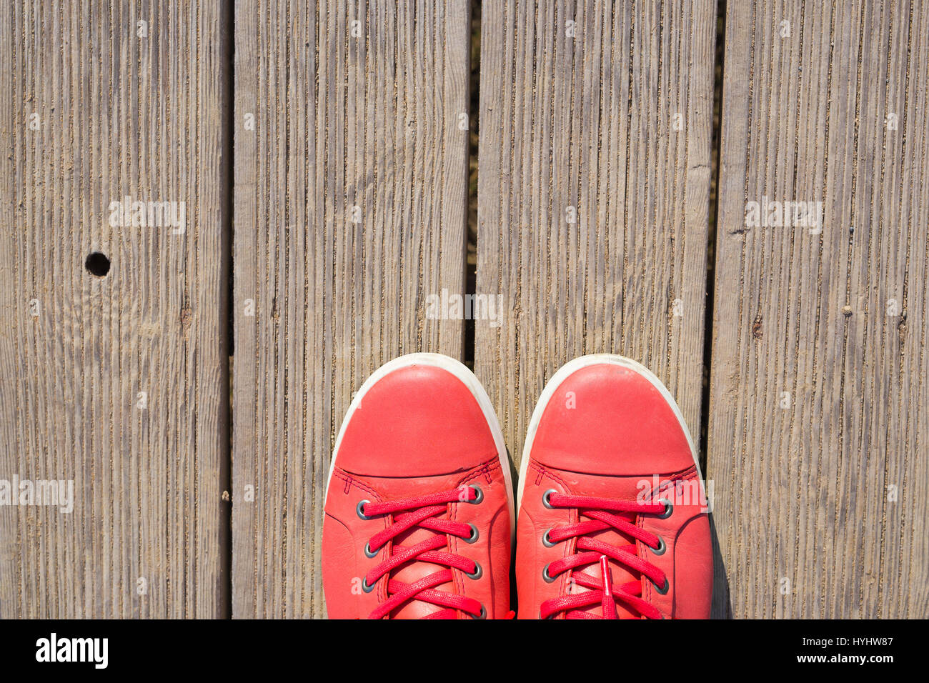 Pink sneakers on the wooden boards Stock Photo - Alamy