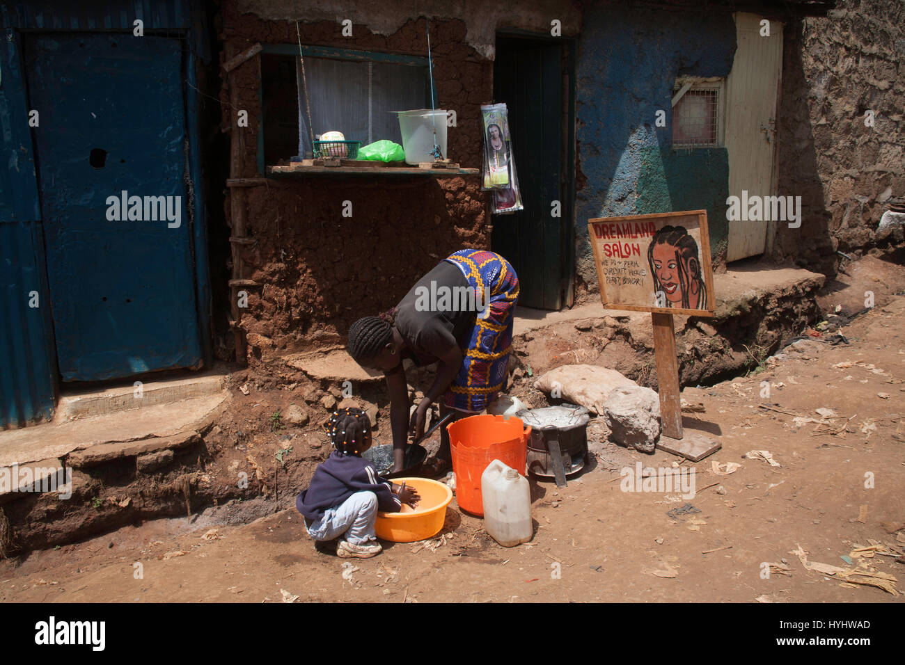 Woman and child wasting outside Dreamland hair salon, Kibera slums,  Nairobi, Kenya, East Africa Stock Photo - Alamy