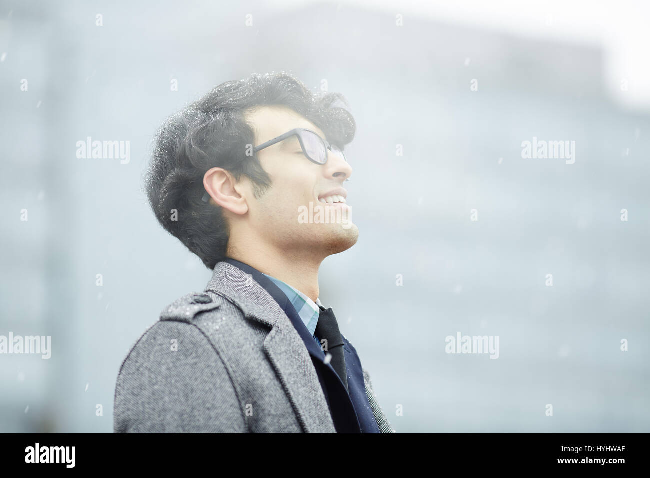 Middle-Eastern Man Enjoying Snow Stock Photo