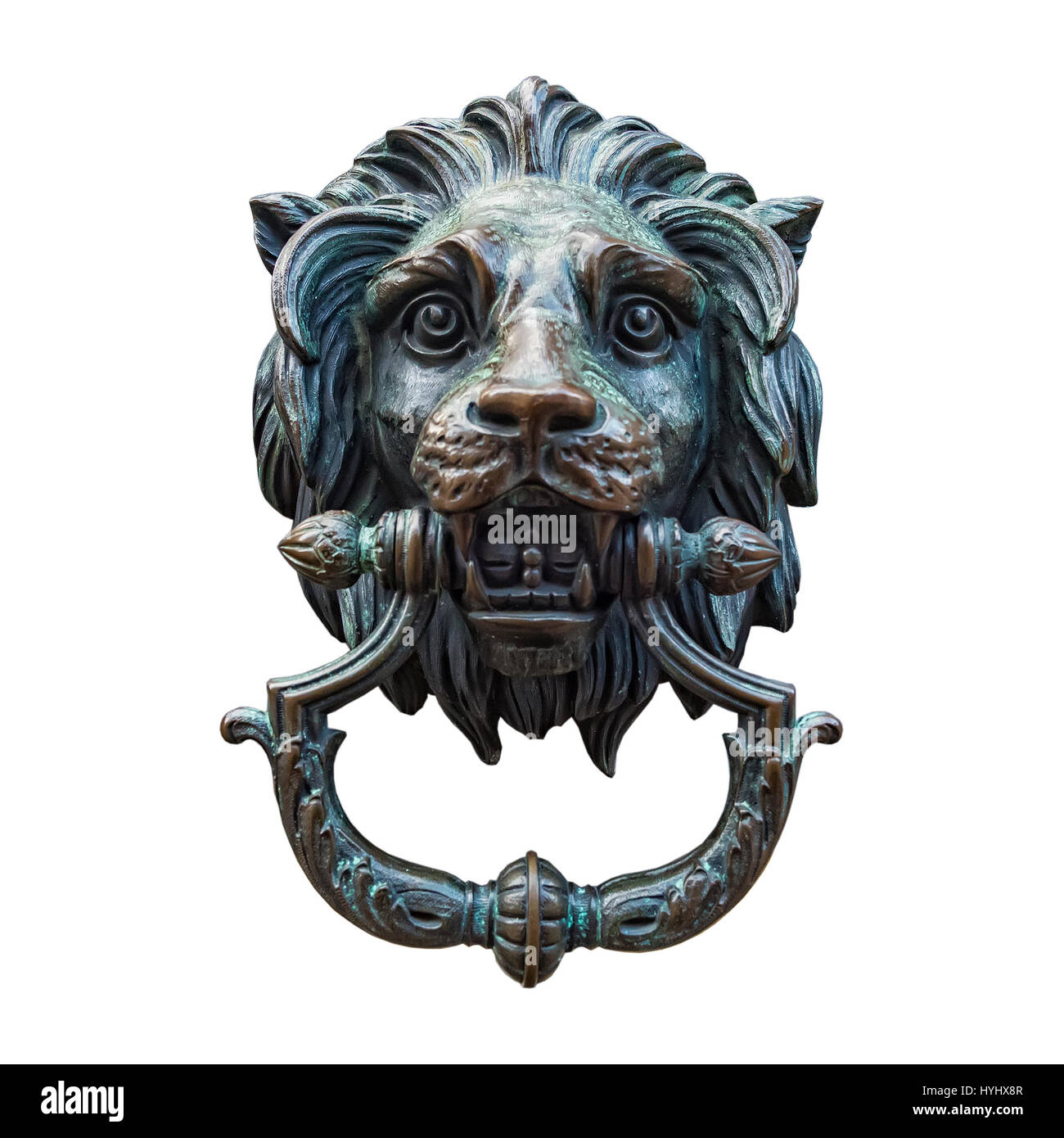 A classic lion head door knocker made out of metal and isolated against a white background. Stock Photo
