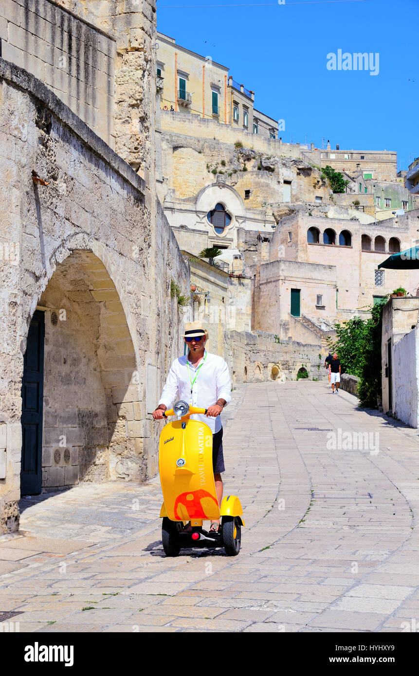 -tourists around the village with an original electric Segway like a vespa- August 20 2016 Matera, Italy Stock Photo