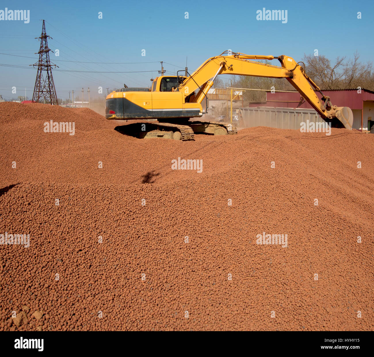 excavator delivers expanded clay Stock Photo Alamy