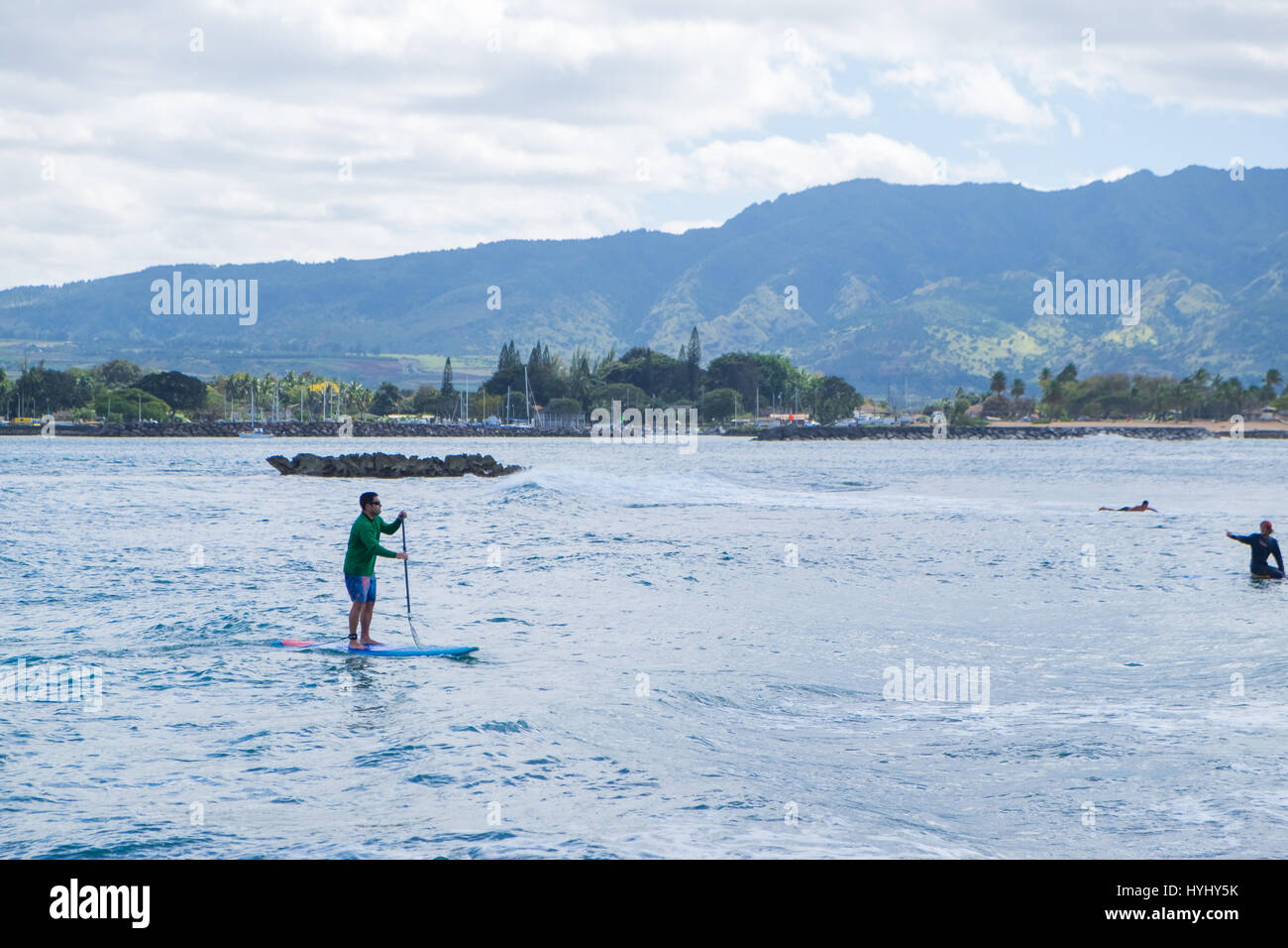HALE'IWA, OAHU, HAWAII - FEBRUARY 23, 2017: Very busy day with many surfers and surf schools in the water catching waves in Haleiwa Oahu Hawaii. Stock Photo