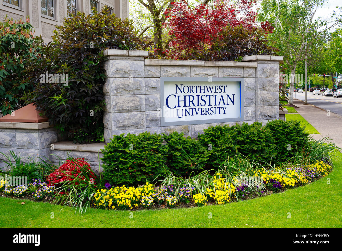 EUGENE, OR - MAY 14, 2015: Sign for Northwest Christian College next to the University of Oregon. Also referred to as NCU or NWCC. Stock Photo