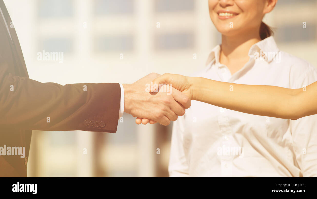 Hand shaking background Stock Photo Alamy