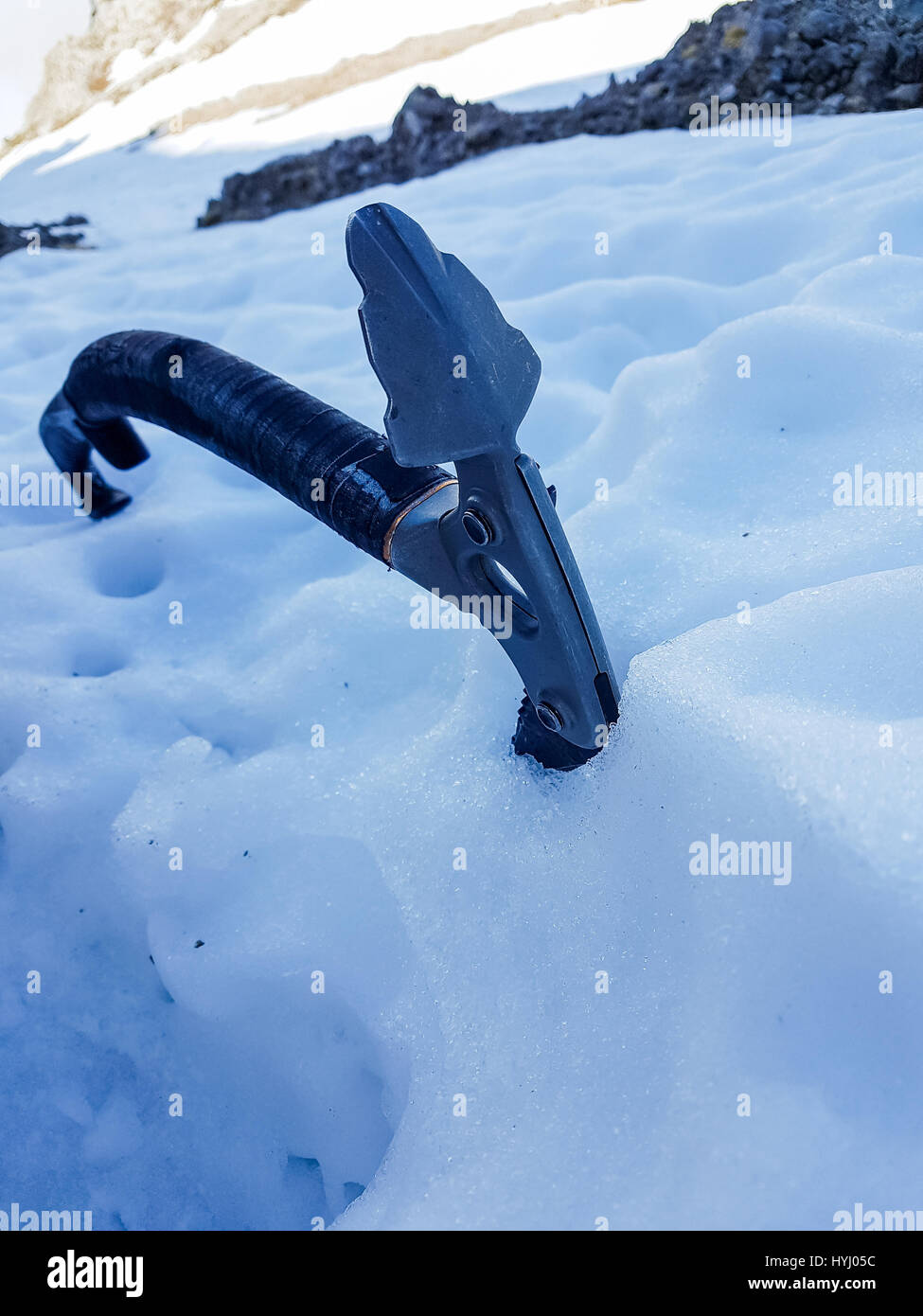Closeup of ice axe on steep slope Stock Photo Alamy