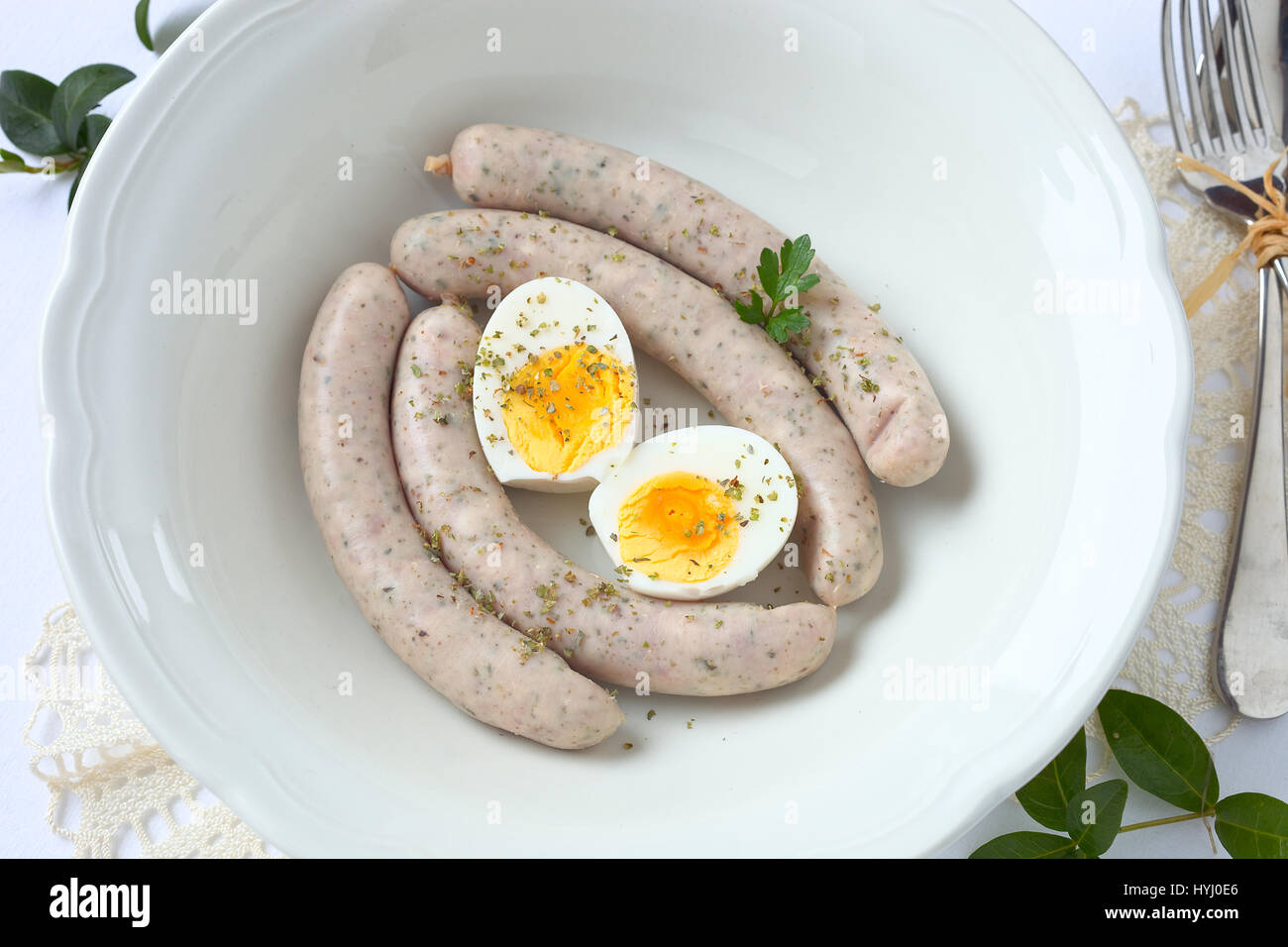 White sausage and egg in a soup bowl. Stock Photo
