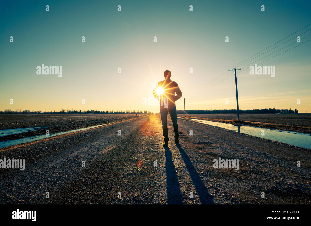 Man is carring the sun under the hand Stock Photo
