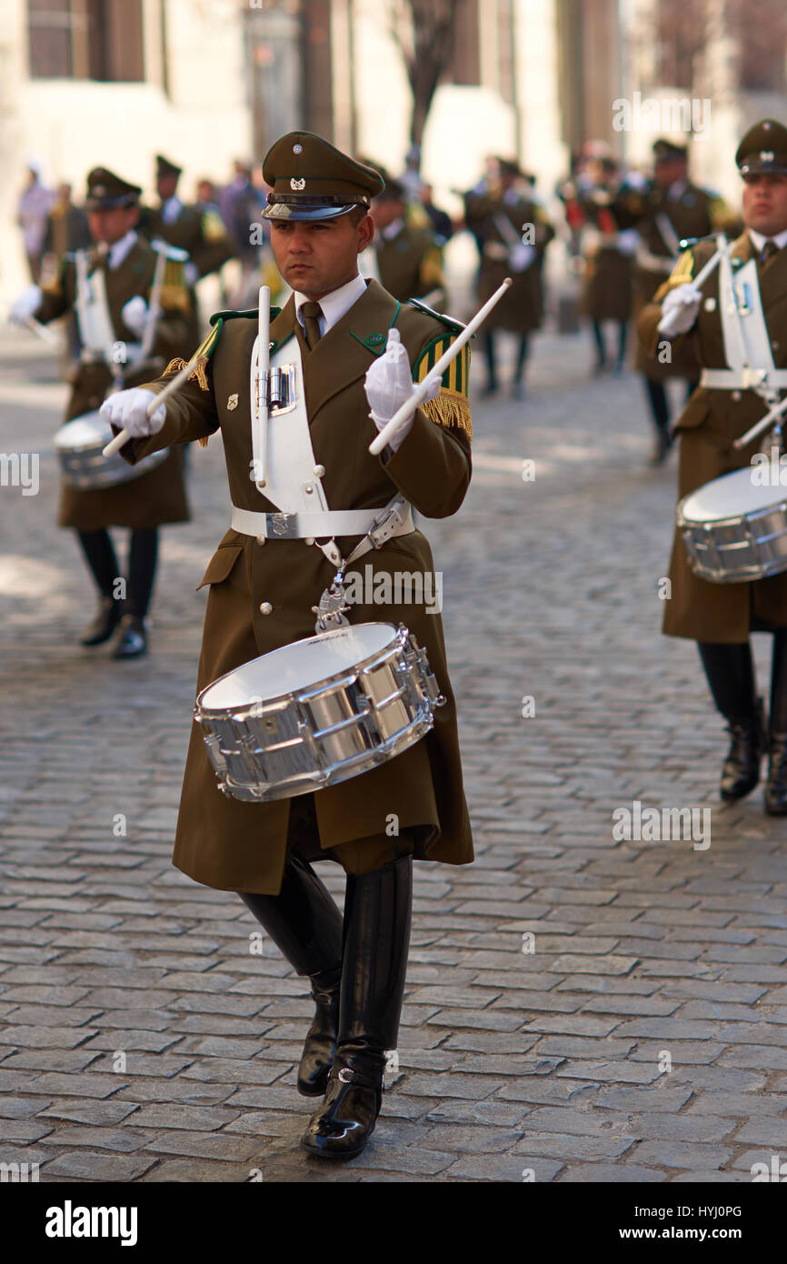 Member of the Carabineros Band marching and playing the drum as part of the changing of the guard ceremony at La Moneda in Santiago, Chile. Stock Photo