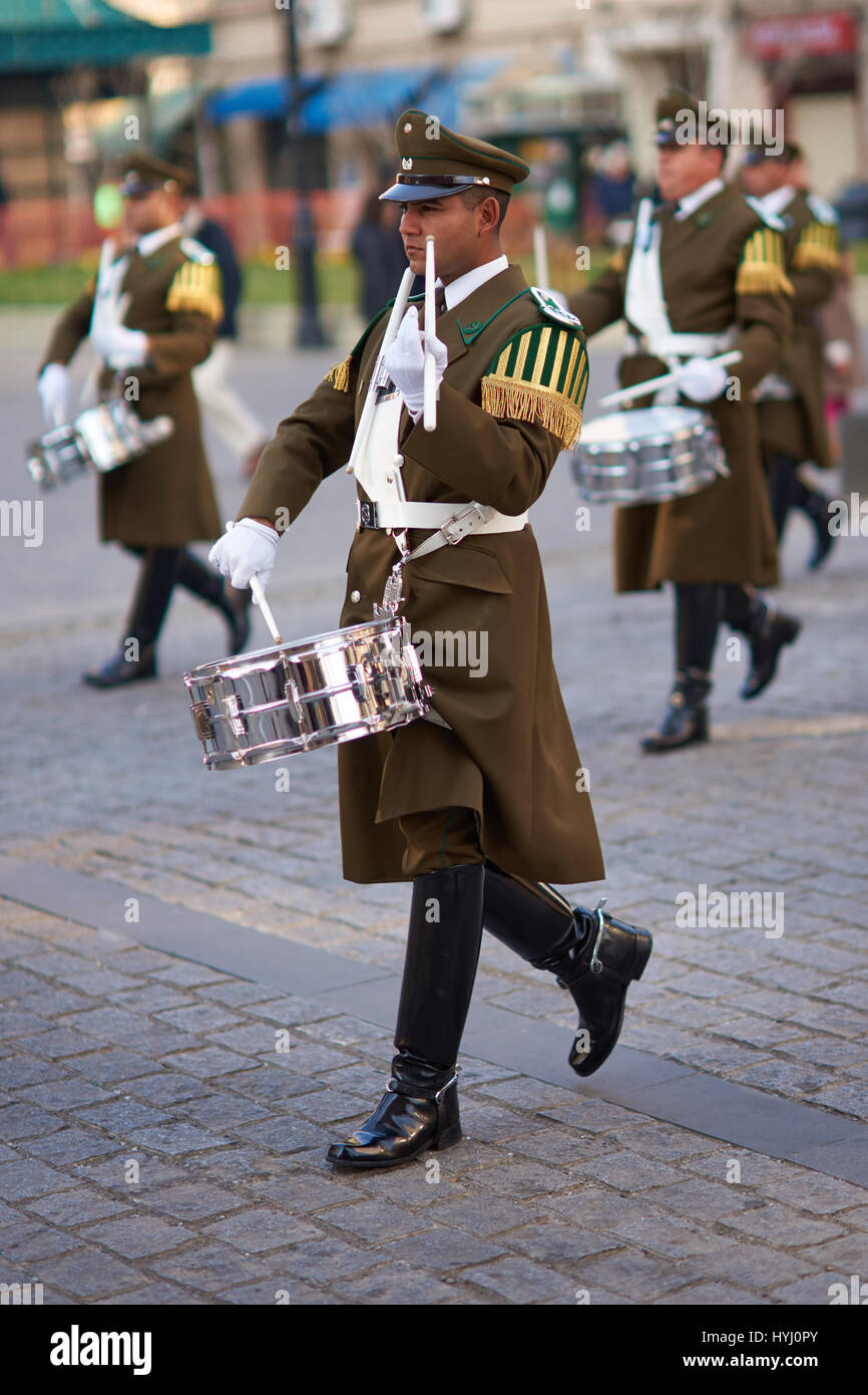 Member of the Carabineros Band marching and playing the drum as part of the changing of the guard ceremony at La Moneda in Santiago, Chile. Stock Photo