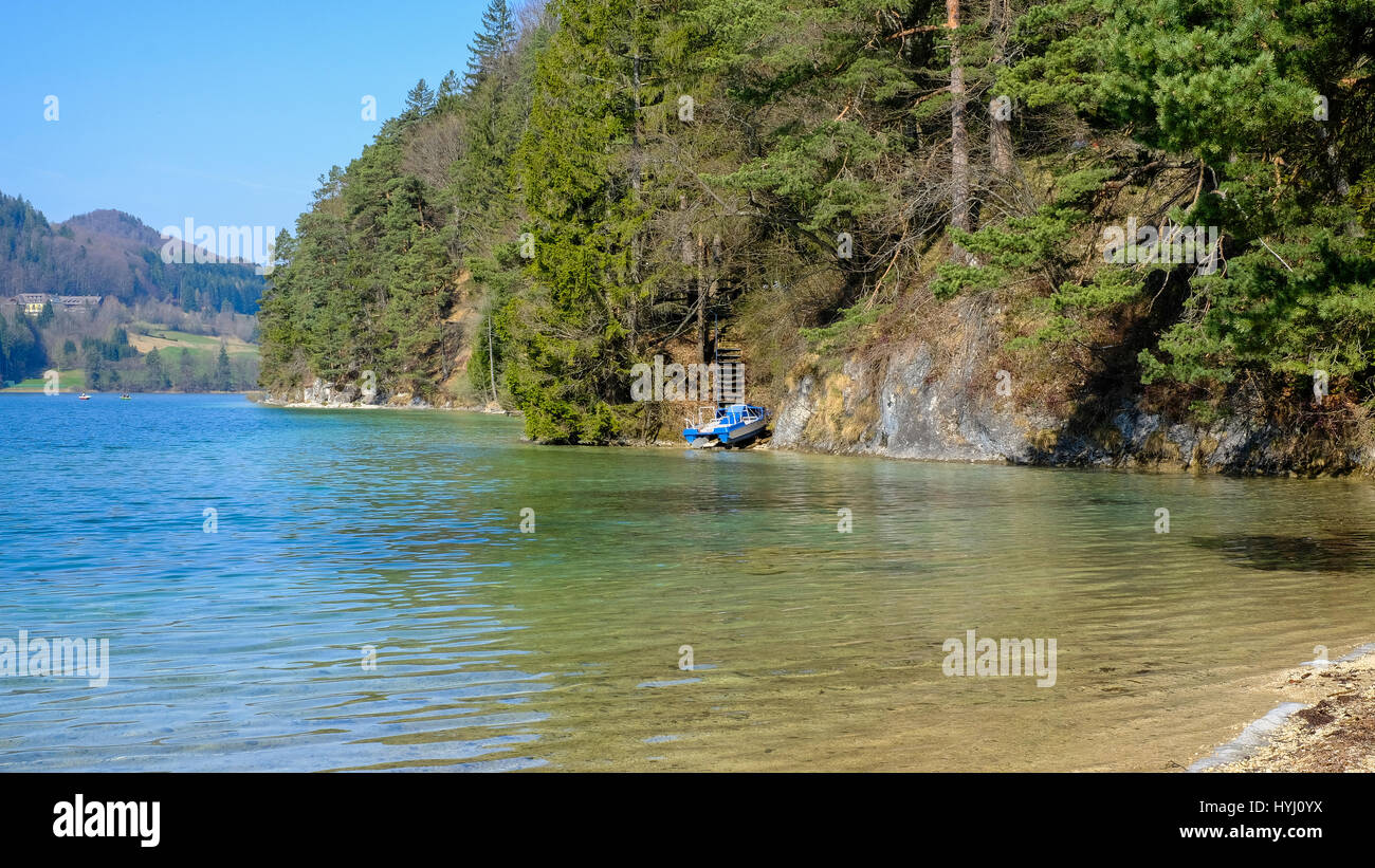 moored boat shore side on lake Fuschlsee Stock Photo