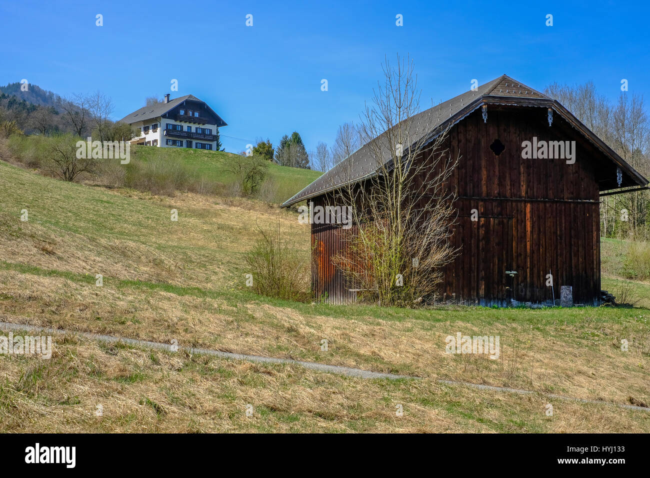 Farm house and barn in Austrian hills Stock Photo