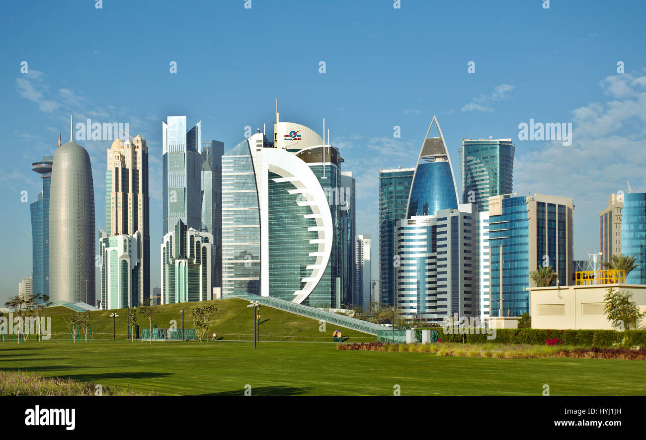 DOHA, QATAR - FEBRUARY 17, 2016: The high-rise district of Doha, seen from the recently completed Hotel Park, with and artificial hill in the foregrou Stock Photo