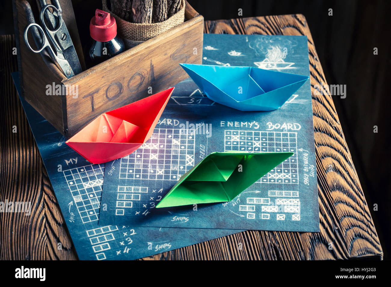 Old battleship paper game with red and blue ships Stock Photo