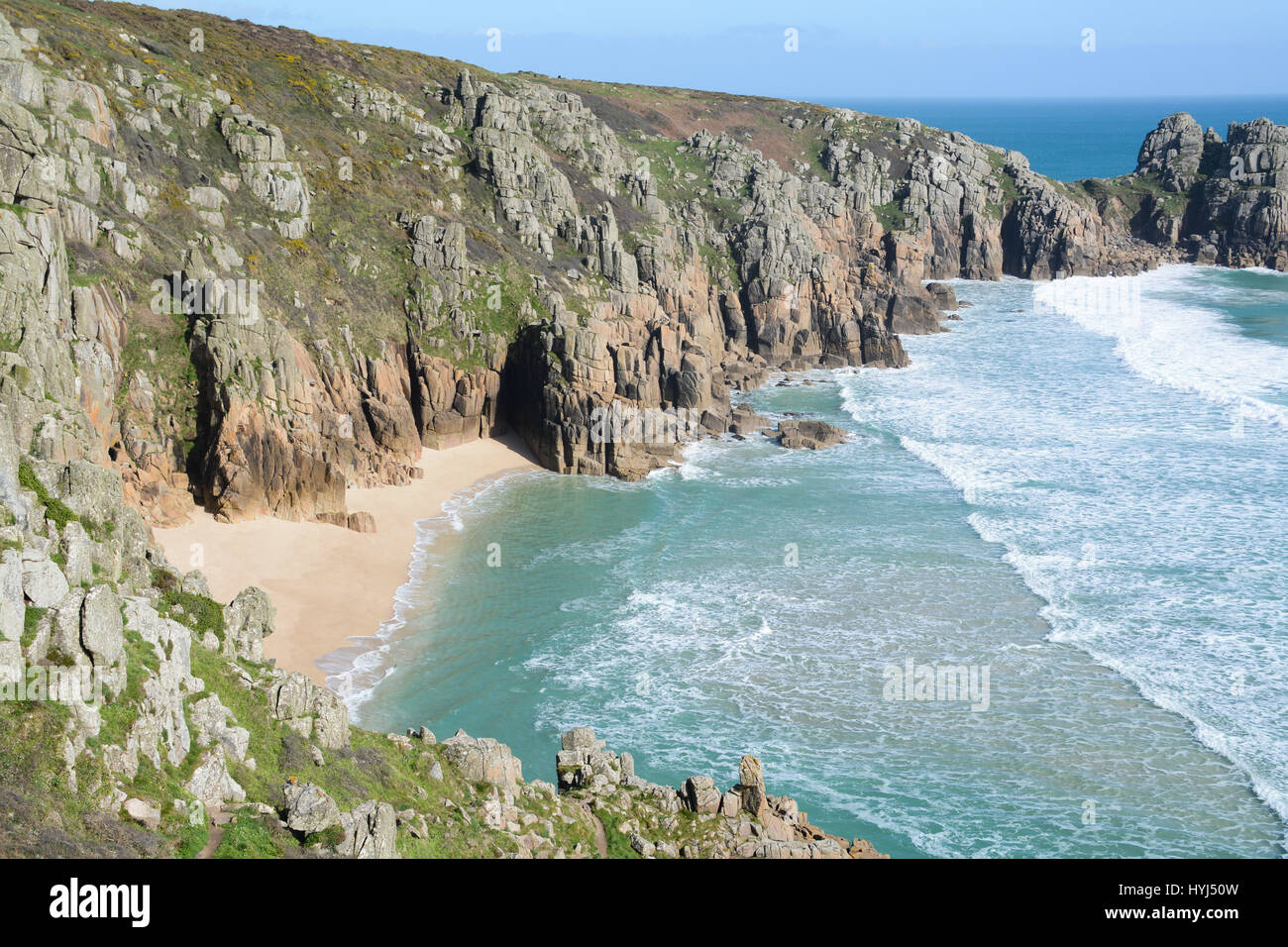 Treen, Cornwall, UK. 4th April 2017. UK Weather. After a dull morning for Easter holidaymakers, the sunshine came out on the turquoise seas and golden sands at Treen and Porthcurno Credit: cwallpix/Alamy Live News Stock Photo