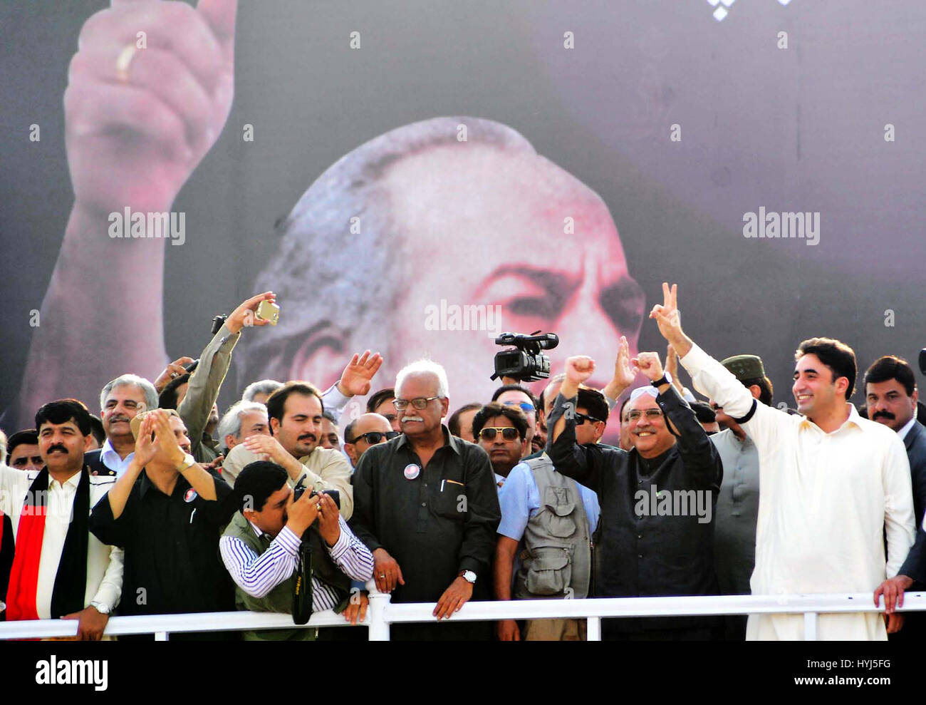 Karachi, Pakistan. 4th April, 2017. Peoples Party (PPP) Co-Chairman, Asif Ali Zardari along with Bilawal Bhutto Zardari and others are waving hands to the crowd on stage during public gather on occasion of 38th death anniversary commemorate of Peoples Party (PPP) Founder, Zulfiqar Ali Bhutto held at Bhutto's Mausoleum in Garhi Khuda Bux on Tuesday, April 04, 2017. Credit: Asianet-Pakistan/Alamy Live News Stock Photo
