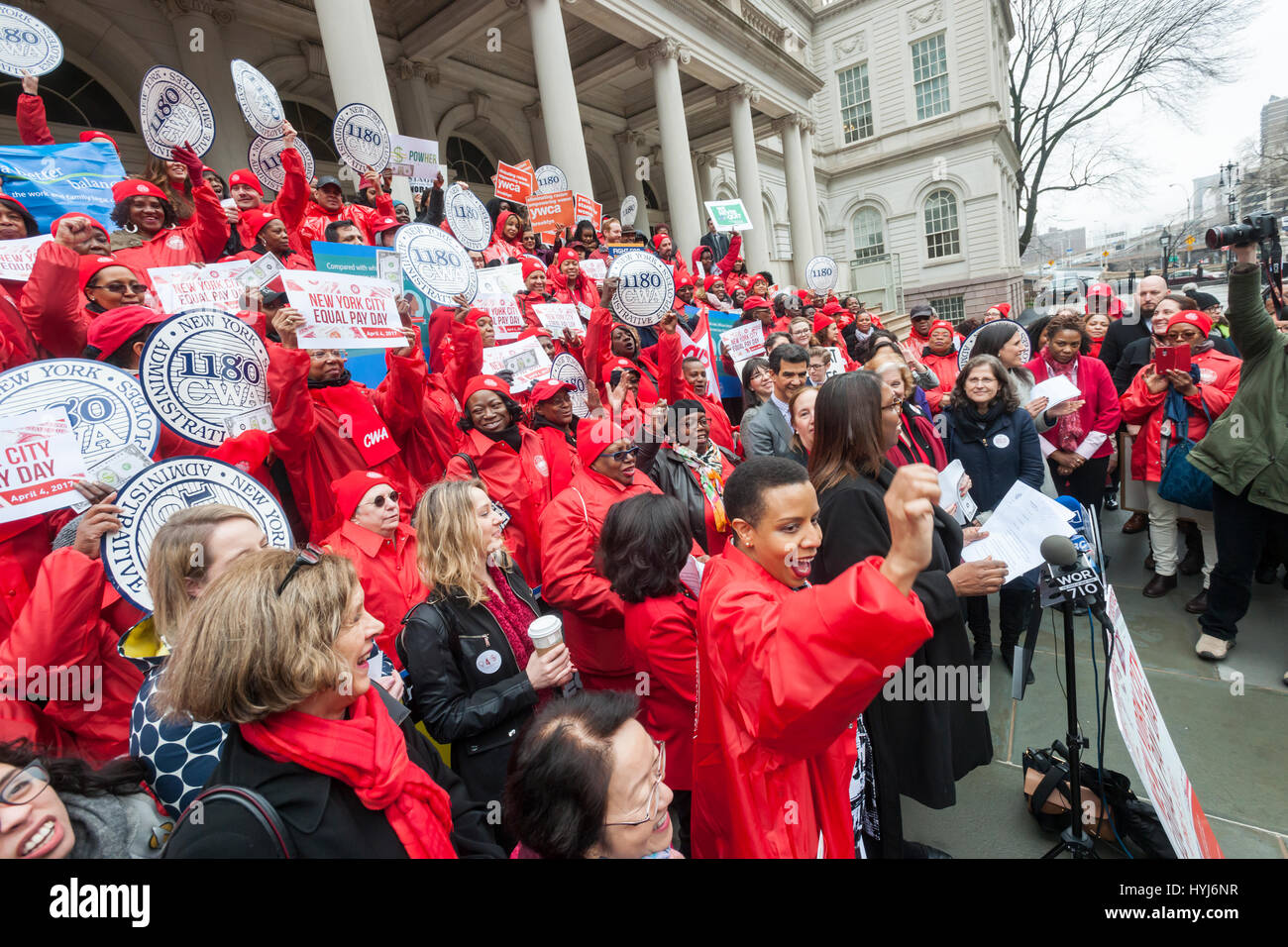 New York, USA. 4th April, 2017. New York, USA. 04th Apr, 2017. Activists, community leaders and politicians gather on the steps of City Hall in New York on Tuesday, April 4, 2017 to rally against pay disparity on the 11th annual Equal Pay Day. Nationwide the gender wage gap is averaged at 20 percent. Legislation set to be voted on tomorrow by the NY City Council would prohibit employers from asking for the wage history of prospective employees, a practice that perpetuates wage inequality. ( © Richard B. Levine) Credit: Richard Levine/Alamy Live News Stock Photo