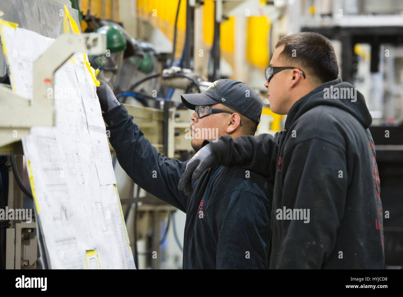 Lancaster, USA. 23rd Mar, 2017. Workers study drawings at a at