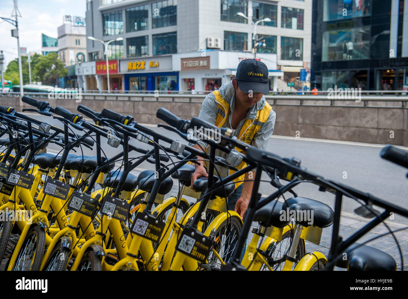 Kunming, China's Yunnan Province. 5th Apr, 2017. A staff member of Ofo, a bike-sharing company, arranges shared bicycles in Kunming, capital of southwest China's Yunnan Province, April 5, 2017. According to a report from Beijing-based BigData Research, by the end of 2016, there were 18.86 million users of shared bicycles, and the number is expected to expand to 50 million by the end of this year. Credit: Hu Chao/Xinhua/Alamy Live News Stock Photo